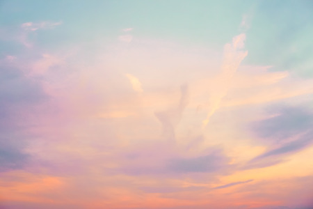 pastel colored skyscape - orange, purple, blue, and whiteの写真素材