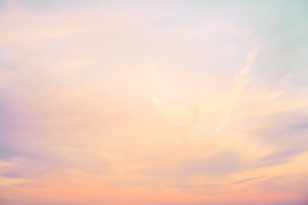 pastel colored cloudy sky - orange, purple, blue, and whiteの写真素材