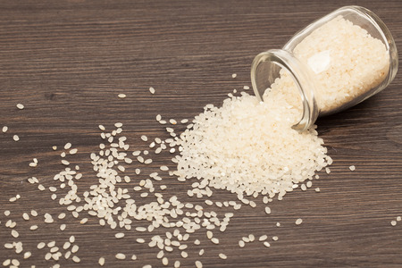 Raw brown rice in a Bottle. Selective focus. Closeup.の写真素材