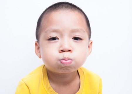 Child. funny little boy. White background