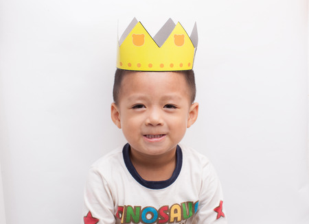 Wearing a birthday hat Chinese boy.の写真素材