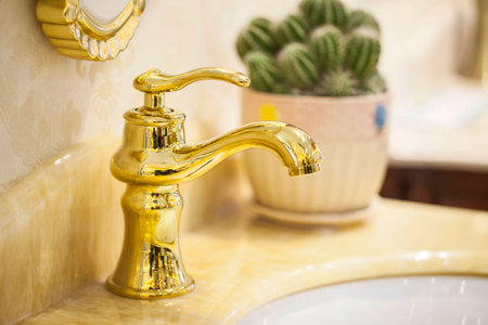 Closeup of water-supply faucet isolated in modern bathroomの写真素材