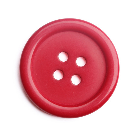 Plastic cloth button closeup on white backgroundの写真素材