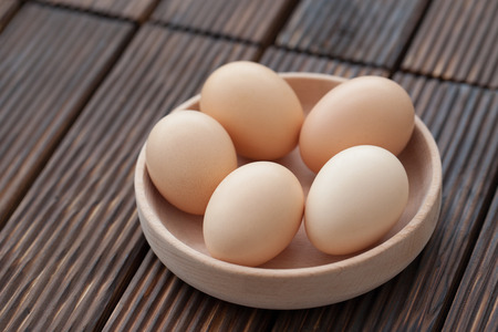 top view of eggs in bowlの写真素材