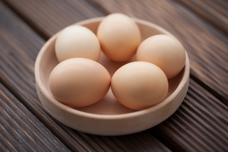 top view of eggs in bowlの写真素材
