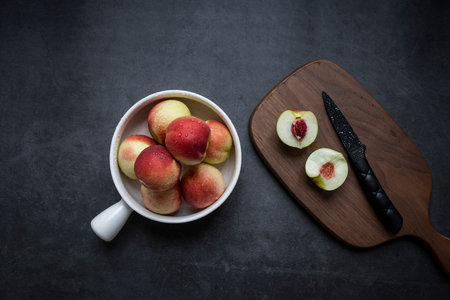 Fresh peaches on a dark gray backgroundの写真素材