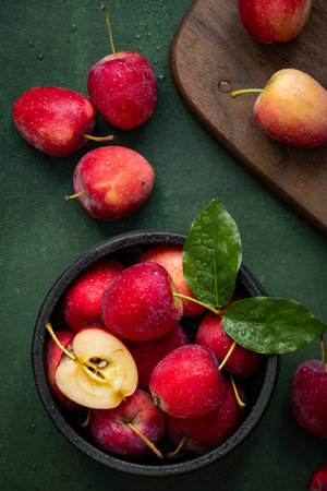 Fresh red apples on a green background.の写真素材