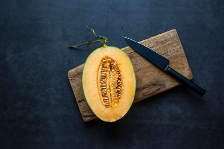Fresh Juicy honeydew melon sliced on dark gray background .healthy food.hami melon.の写真素材