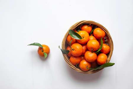 Fresh oranges seen from above on white background. Healthy food. Flat lay. Winter time fruits.の写真素材