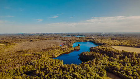 Tranquil Blue Lake Between Lush Forests.の写真素材