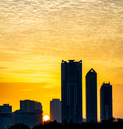 futuristic Al Majaz district. Residential Modern skyscraper buildings in the United Arab Emirates.on a beautiful day sunsetの写真素材