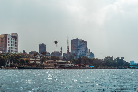 A stunningly serene view of Cairos magnificent skyline, with the beautiful Nile River flowing in the foregroundの写真素材