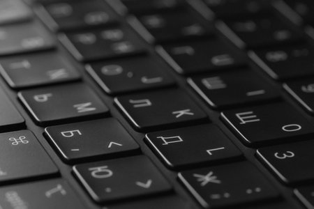 A detailed closeup view of a sleek, modern black keyboard designed for tech enthusiastsの写真素材