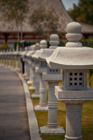 Stone lanterns in the garden of the Buddhist temple. Selective focus.の写真素材