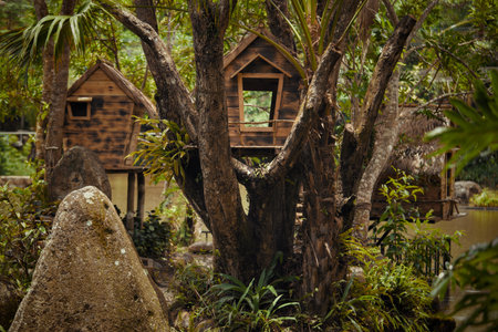 Imagine a cozy treehouse in nature, with lush greenery and serene rocks, ideal for relaxation and...