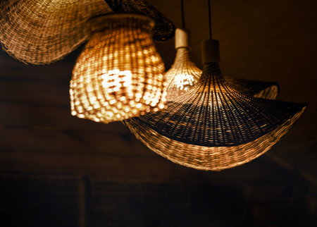 These stylish woven pendant lights are creating a warm and inviting ambiance that enhances the entire atmosphereの写真素材