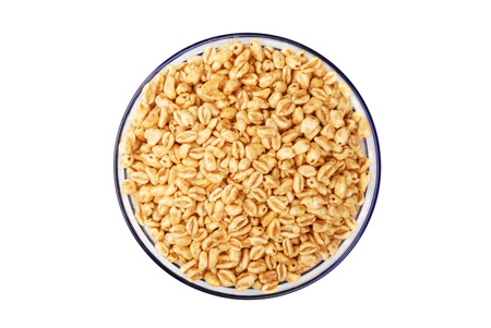 Popped wheat grains in cup  isolated on white の写真素材