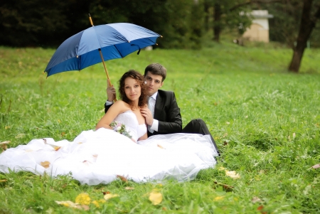 young bride and the bridegroom in the parkの写真素材