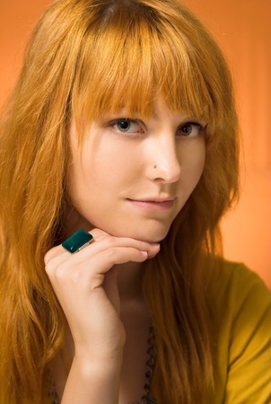 Studio portrait of beautiful young redhead girl.の写真素材