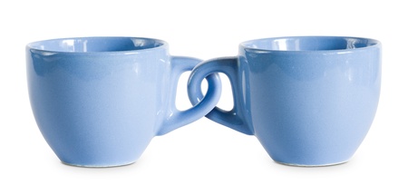 Two for the price of one cups, concept on blue coffe cops with interlocked handles.の写真素材