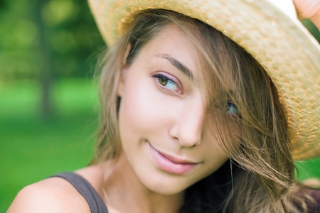 Beautiful young spring brunette posing outdoors in nature.の写真素材