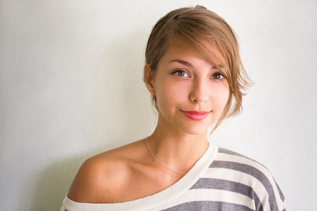 Summer portrait of a beautiful young brunette girl.の写真素材