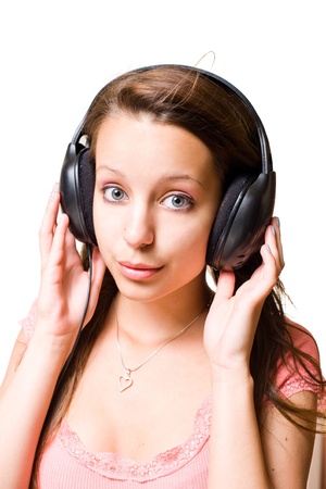 Gortgeous young brunette girl whistling with headphones.の写真素材