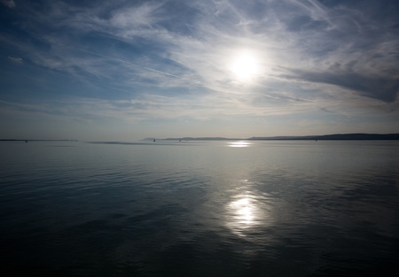 Rows of small boats in the distance sailing to the horizon.の写真素材