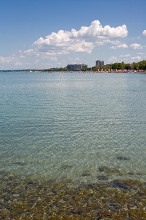 distant view of summer beach resort on lake balatonの写真素材