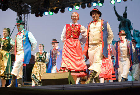 EGER - AUGUST 18: Traditional Polish folk dance performers on stage at night, as part of the St Sephenのeditorial素材