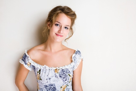 Portrait of a friendly, fashionable confident young blond woman with copy space.の写真素材