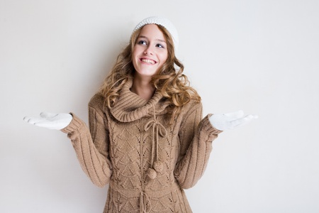 Portrait cheerful gesturing winter fashion girl.の写真素材