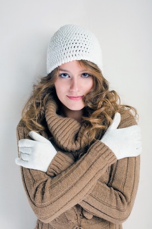 Portrait of cheerful winter fashion girl warming up for the cold season.の写真素材