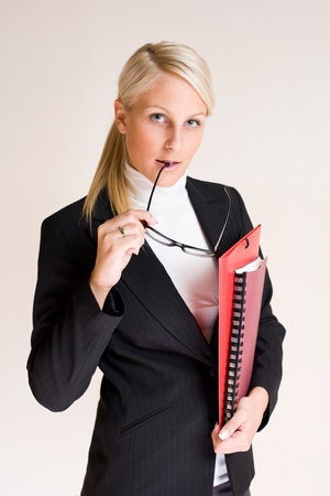 Portrait of attractive friendly thoughtful business woman.の写真素材