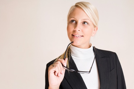 Portrait of attractive friendly thoughtful business woman.の写真素材