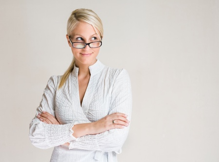 Portrait of friendly young business woman taking a sideways glance.の写真素材