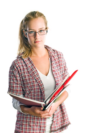 Portrait of pretty young student girl holding exercise books and folder isolated on white background.の写真素材