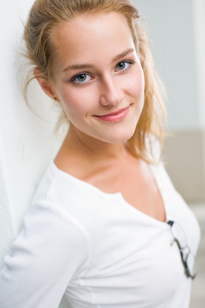 Closeup portrait of a fresh friendly young blond woman.の写真素材