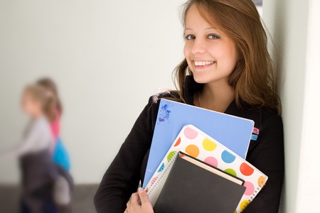 Portrait of happy young student girl.の写真素材
