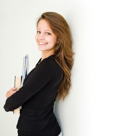 Portrait of happy young student girl.の写真素材