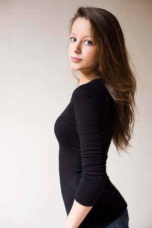 Half length portrait of attractive fit slender young brunette woman.の写真素材