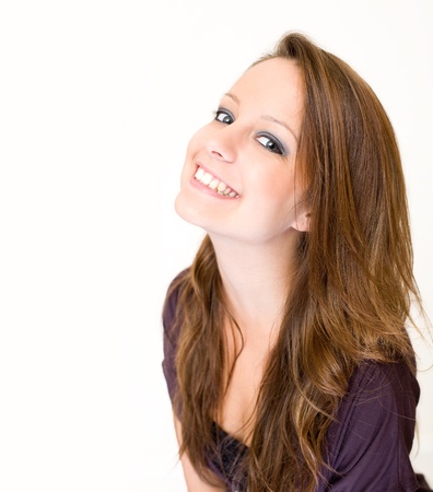 Closeup portrait of exuberant young brunette woman.の写真素材