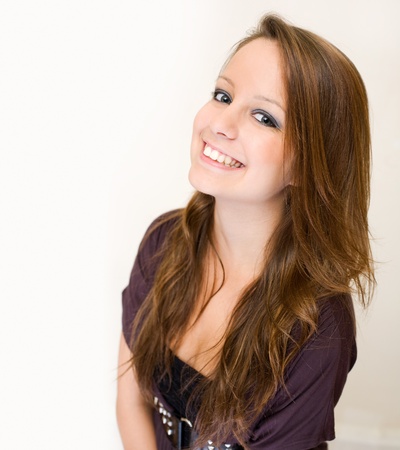 Closeup portrait of exuberant young brunette woman.の写真素材