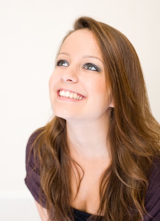 Closeup portrait of exuberant young brunette woman.の写真素材
