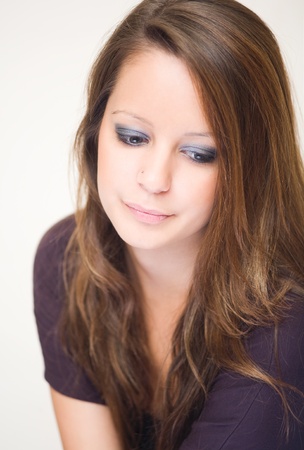 Closeup portrait of beautiful sad young brunette woman.の写真素材
