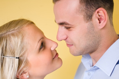 Closeup portrait of an attractive young couple looking at each other.の写真素材