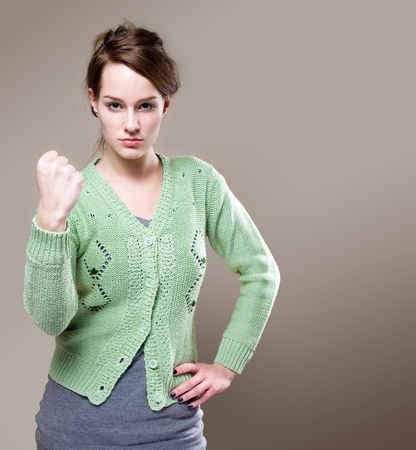Portrait of beautiful young brunette with very aggressive stance.の写真素材