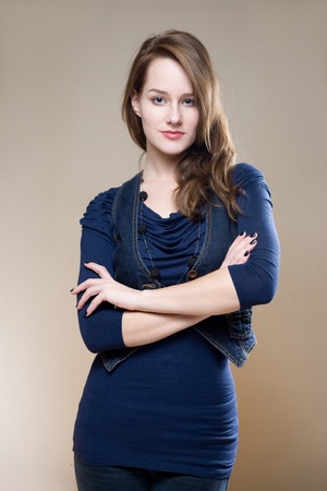 Half length portrait of a very confident young brunette woman.の写真素材
