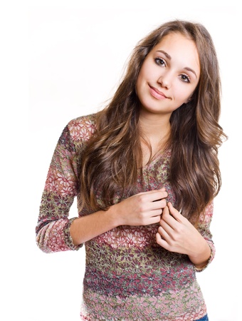 Half lenght portrait of a beautiful fashionable friendly brunette girl.の写真素材