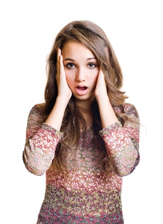 Half length portrait of a gorgeous young brunette girl looking shocked.の写真素材